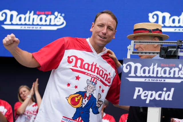 Joey Chestnut Retains Hot Dog Eating Championship, Consuming Staggering Number of Calories : hot dog eating contest 2023